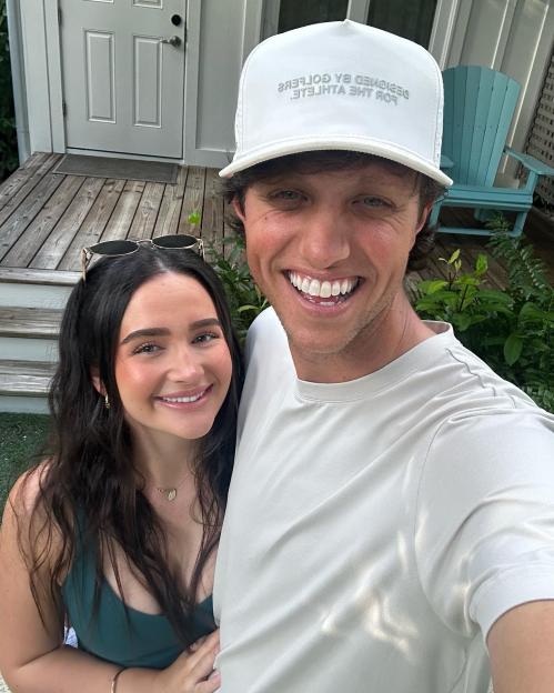 Smiling couple posing for a selfie.