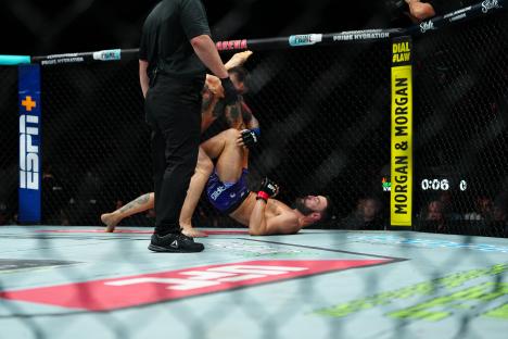Paul Craig and Rodolfo Bellato fighting in a UFC match.
