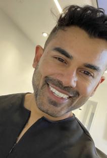 Close-up of Dr. Kal Prajapat smiling.