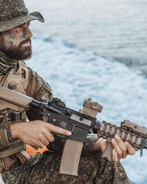 Soldier holding a rifle.