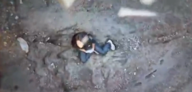 Person lying on the ground.