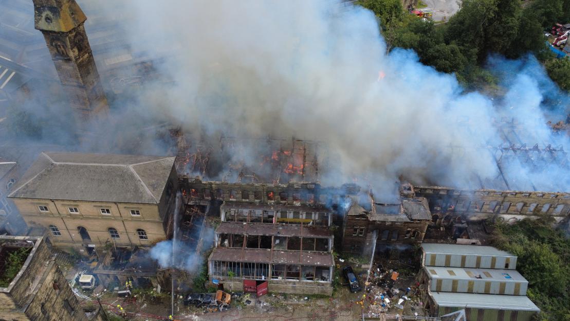 Aerial view of firefighters battling a large fire at Dalton Mills.