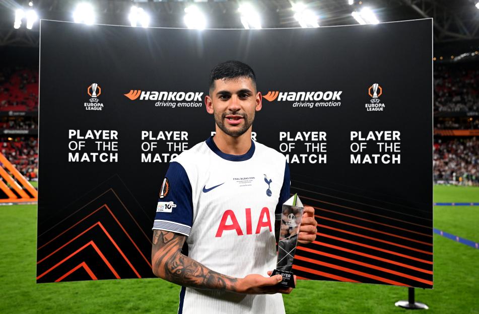 Cristian Romero of Tottenham Hotspur holding the UEFA Europa League Player of the Match award.