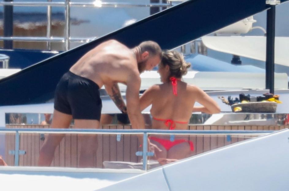 BGUK_3299374 - *PREMIUM-EXCLUSIVE* PORTOCERVO, ITALY MUST CALL FOR PRICING BEFORE USAGE - UFC star Conor McGregor marked his 37th birthday in lavish fashion, celebrating with his family aboard a luxury yacht in the stunning coastal town of Porto Cervo, Sardinia...A cheeky Conor gets a little amorous with his longtime partner Dee Devlin, patting her on her bum as the pair soak up the sun, but Conor is surrounded by controversy as reports claimed the American rapper Azealia Banks has taken to social media to accuse Conor McGregor of sending her nudes, before leaking alleged X-rated photos of the UFC legend and he is also facing a new civil lawsuit filed by a woman accusing him of sexual assault during the 2023 NBA finals in Miami.....Pictured: Conor McGregor, Dee Devlin....BACKGRID UK 15 JULY 2025 ....UK: +44 208 344 2007 / uksales@backgrid.com....USA: +1 310 798 9111 / usasales@backgrid.com....*Pictures Containing Children Please Pixelate Face Prior To Publication*