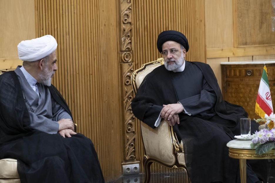 Iranian President Ebrahim Raisi and Hojjatal Islam Mohsen Qomi speaking.
