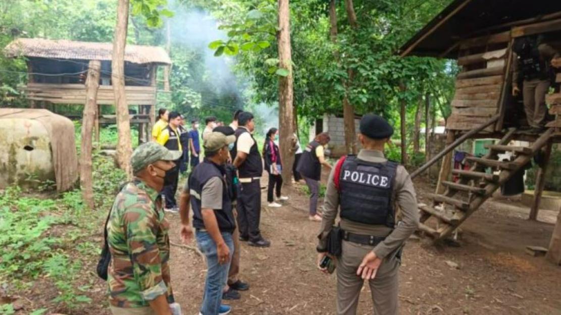 Officials investigating the home of an 8-year-old boy in Thailand.