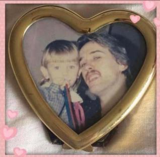 Photo of a father and young daughter in a heart-shaped frame.