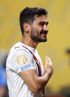 Ilkay Gundogan celebrating after a soccer match.