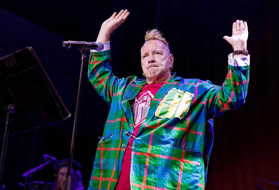 John Lydon of Public Image Ltd performing live on stage.