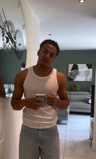 Kyle Ashman holding a mug.