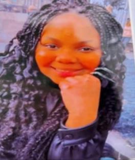 Photo of a young woman with long braids.