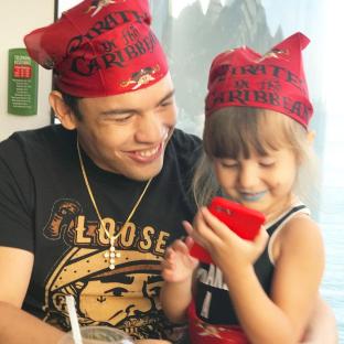 Julio Cesar Chavez Jr. and his daughter wearing Pirates of the Caribbean bandanas.