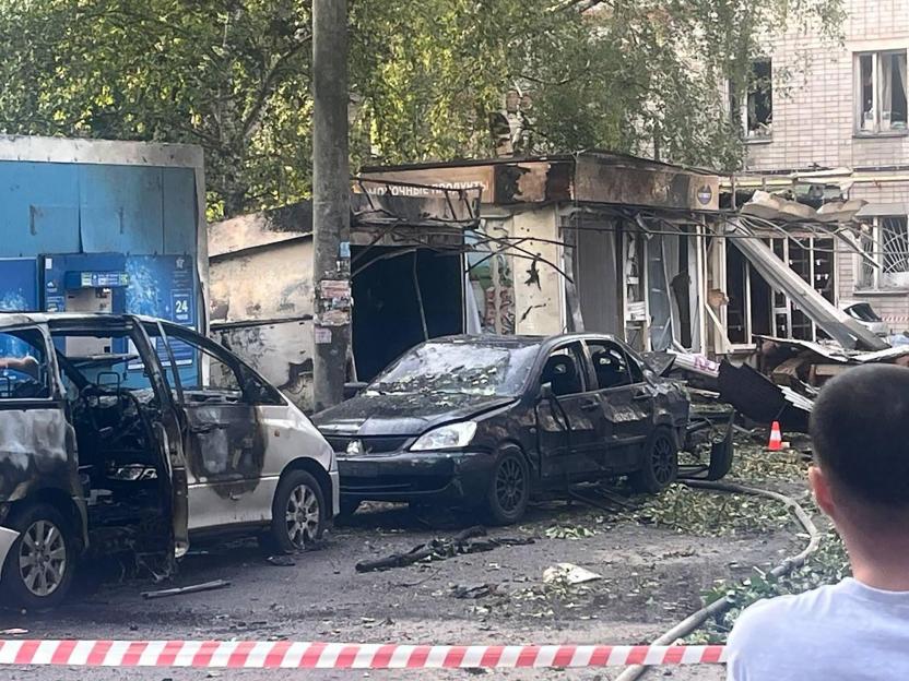 Damage to cars and a building from a drone attack in Voronezh.