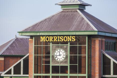 Morrisons supermarket exterior with clock.