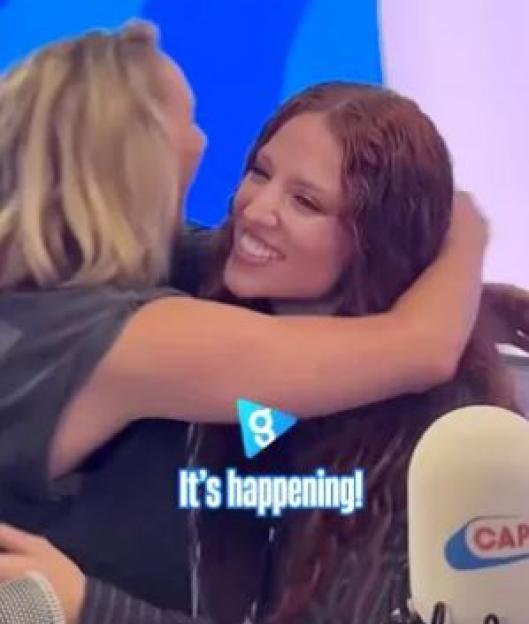 Jess Glynne hugging the Jet2 voiceover star.