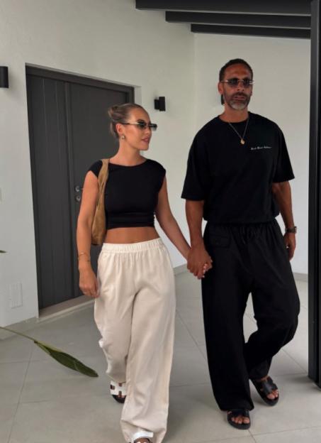 Kate Ferdinand and Rio Ferdinand holding hands.