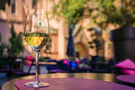 Glass of Alsatian white wine on a restaurant table.