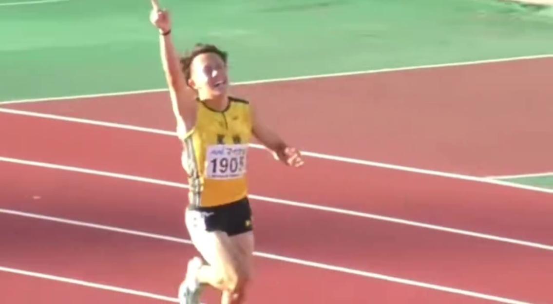 A 16-year-old Japanese sprinter celebrates after winning a race.