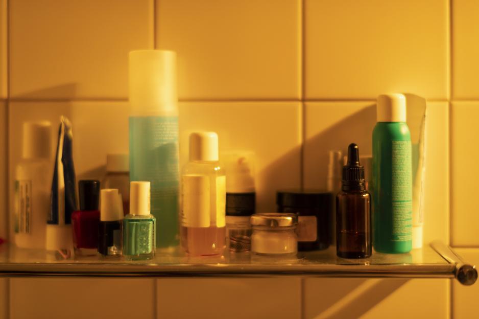 Bathroom shelf with toiletries.