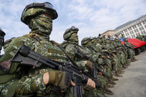 Taiwanese soldiers standing guard with rifles.