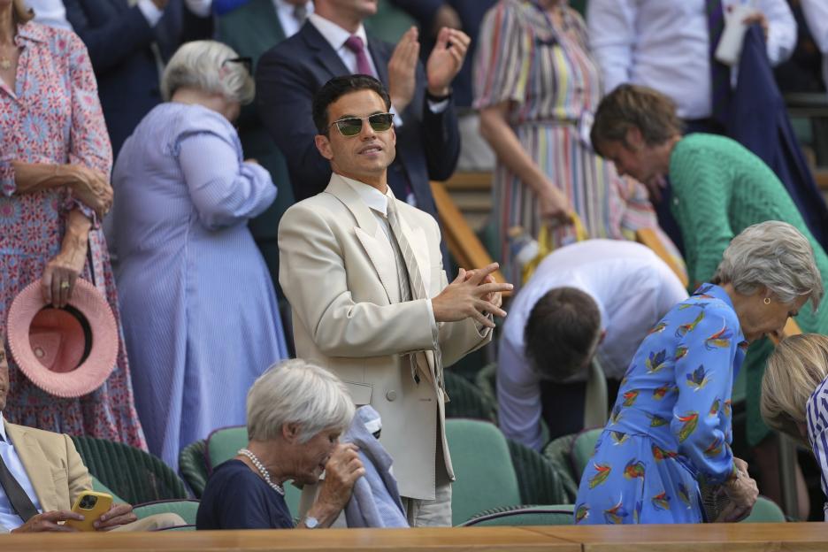 Rami Malek applauding at Wimbledon.
