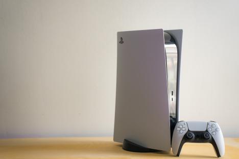PlayStation 5 console with DualSense controller.