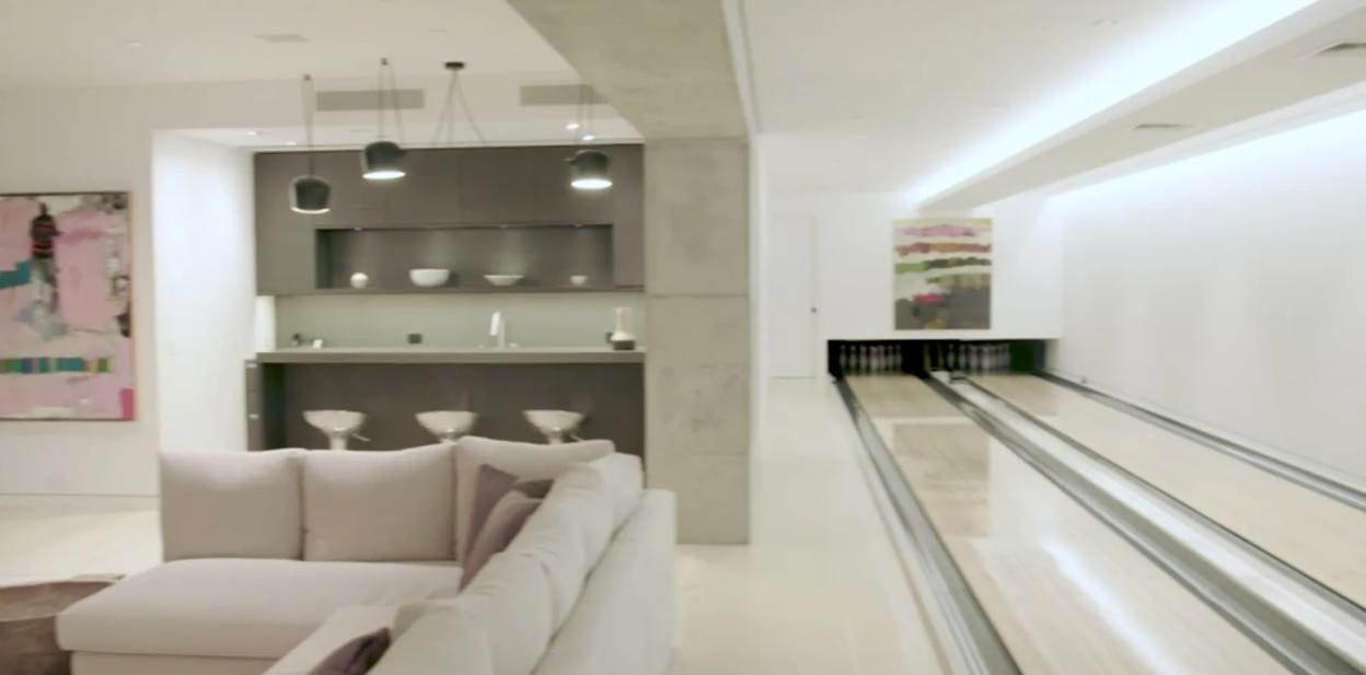 Interior view of Maria Sharapova's house, showing a bowling alley and a lounge area.