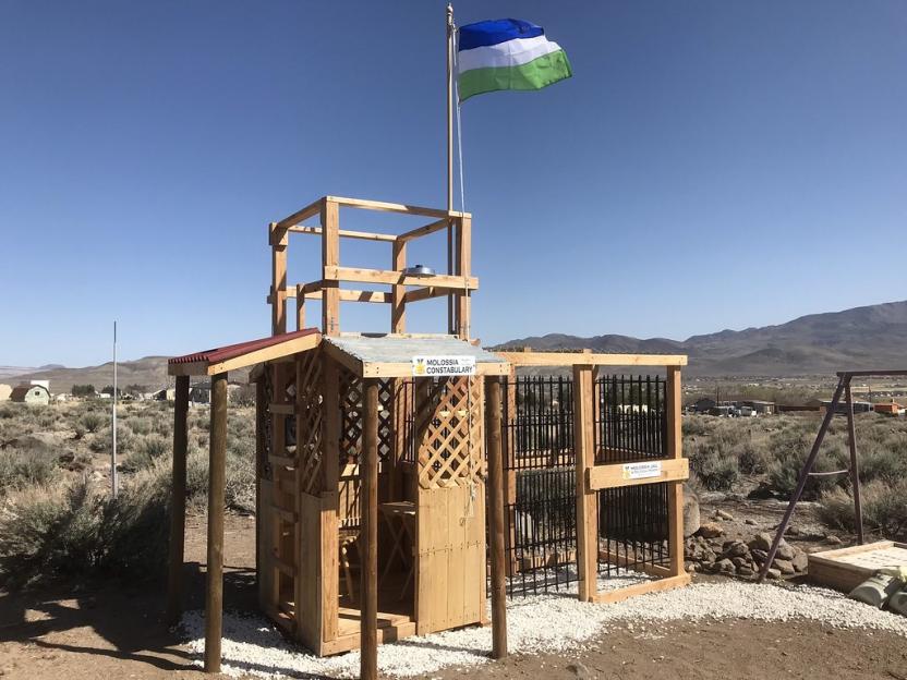 Molossia Constabulary building and flag.