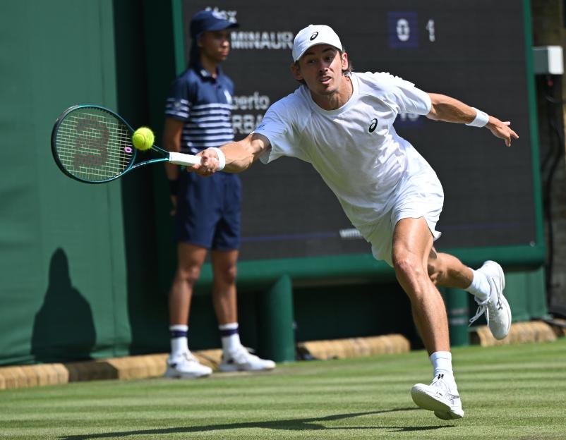 Alex de Minaur of Australia playing tennis at Wimbledon.