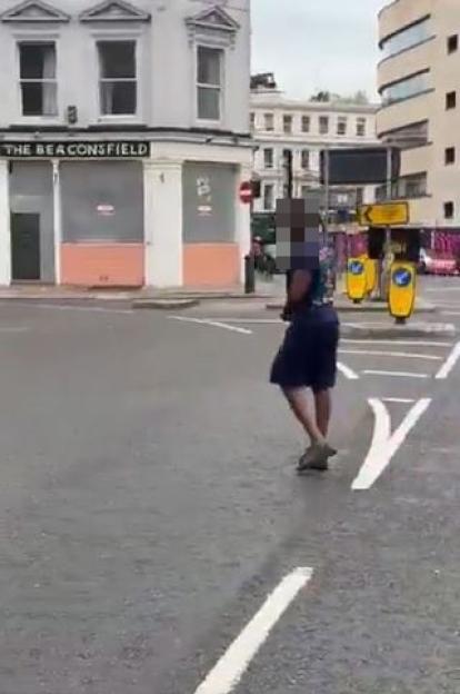 Person walking away after slashing a truck's tires.