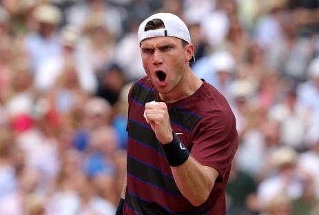 Jack Draper celebrates winning a tennis match.