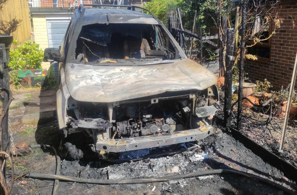 Burnt-out Land Rover.