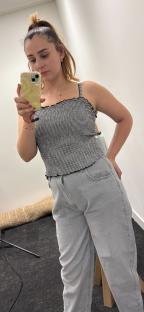Woman trying on children's clothing.