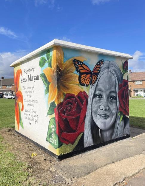 Mural of Keely Morgan with flowers and a butterfly.