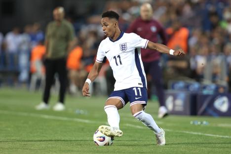 Omari Giraud-Hutchinson of England dribbling the soccer ball.