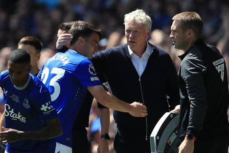 Everton manager David Moyes pats Seamus Coleman on the head as he is substituted during a Premier League match.