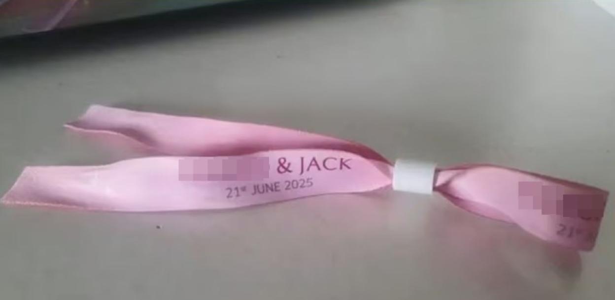 Pink wedding wristband for [redacted]'s and Jack's wedding on June 21st, 2025.