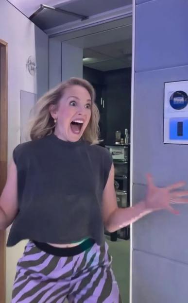 Jess Glynne reacting excitedly.
