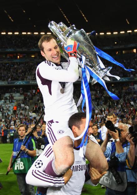 Petr Cech celebrates a trophy victory.