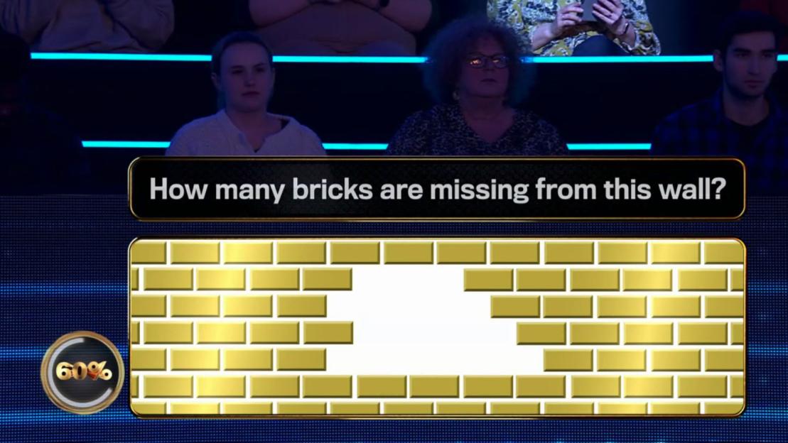 Screenshot of a game show question: How many bricks are missing from this wall? A partially-complete gold brick wall is shown.