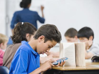 Student using a mobile phone in class.