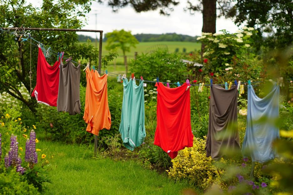 Clothes hanging on line in garden; Shutterstock ID 1241259232; purchase_order: -; job: -; client: -; other: -