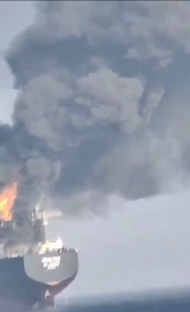Ship on fire at sea.