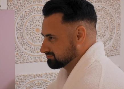 Man in a white bathrobe.