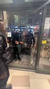 A McDonald's employee slapping a person during a brawl.