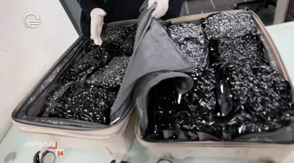 Two suitcases filled with confiscated contraband.