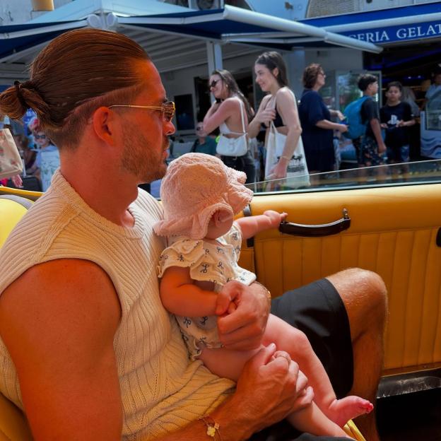 Jack Grealish holding his baby daughter.