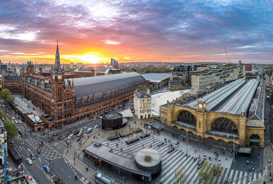 Aerial view of St. Pancras and King's Cross stations at sunset.