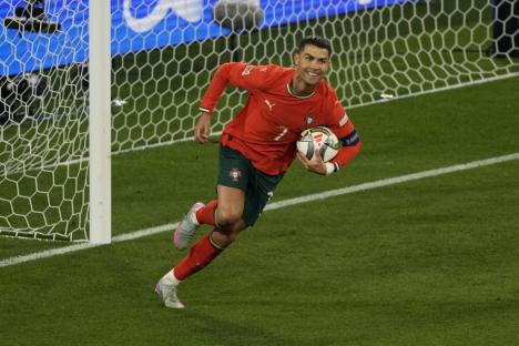 Portugal's Cristiano Ronaldo celebrates after scoring his side's second goal against Spain during the Nations League final soccer match between Portugal and Spain at the Allianz Arena in Munich, Germany, Sunday, June 8, 2025. (AP Photo/Michael Probst)