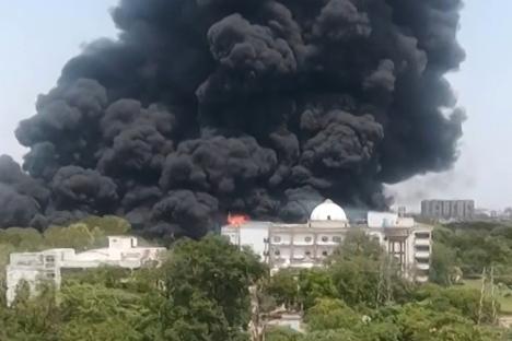 Smoke billowing from a building fire.